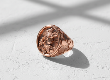 Rose gold plated silver rooster ring featuring an intricate warrior cameo with a rooster helmet and sunburst detail.