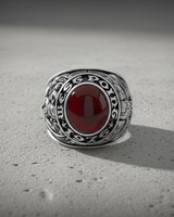 Front view of the 1976 Silver West Point ring, highlighting the deep red cabochon stone and engraved bezel letters.