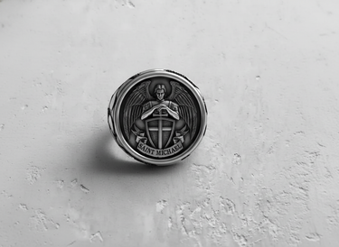 Top-down view of the 925 sterling silver Saint Michael ring face, detailing the Archangel's wings, sword, and shield.