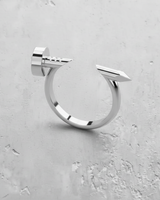 The silver nail ring in a high-polish 925 sterling silver finish, reflecting light to showcase its sleek, modern form.