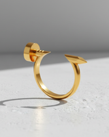 Gold vermeil silver nail ring with a polished finish, showing the flat nail head and pointed tip on a textured white surface.