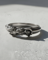 Angled view of the 925 sterling Silver Goddess Ring, highlighting the intricate sculptural drapery and form on a plain background.