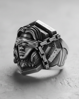 Angled view of the handcrafted Silver Blind Justice Ring, highlighting the deep oxidized finish and armored pauldron design.