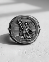 Front view of the sterling silver Archangel Michael ring, showcasing the intricate details of his sword and scales of justice.