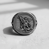 Front view of the sterling silver Archangel Michael ring, showcasing the intricate details of his sword and scales of justice.