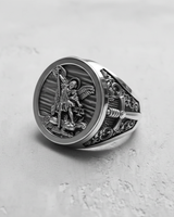 Angled shot of the men's Archangel Michael signet ring, highlighting the detailed craftsmanship and oxidized silver finish.