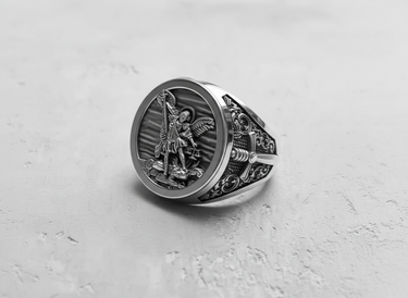 Angled shot of the men's Archangel Michael signet ring, highlighting the detailed craftsmanship and oxidized silver finish.
