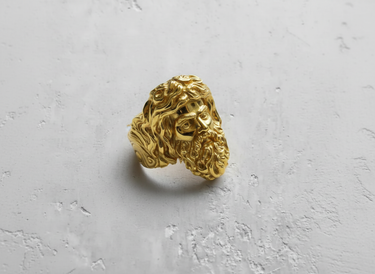 Yellow gold plated Silver Zeus Ring shown at an angle, capturing the lustrous finish and powerful mythological design details.