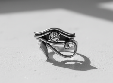 Black and white photo of the 925 sterling Silver Eye of Horus ring, highlighting its polished curves and deep shadow play.
