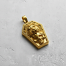 Gold vermeil coffin shaped pendant featuring a roaring lion and skull design on textured background