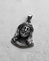 Oxidized 925 sterling silver Jesus face pendant showing deep relief and intricate facial features