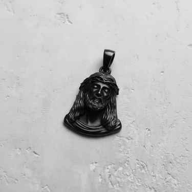 Men's black rhodium-plated Jesus pendant, close-up shot showcasing the matte finish and intricate facial and hair details.