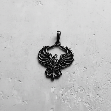 Black rhodium plated silver phoenix pendant with symmetrical wings and ornate tail feathers on white background