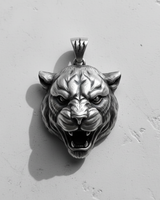 Front view of handcrafted 925 sterling silver tiger head pendant showing sharp teeth and claw mark bail detail