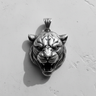 Front view of handcrafted 925 sterling silver tiger head pendant showing sharp teeth and claw mark bail detail