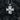 Angled view of silver religious cross pendant displaying intricate craftsmanship and sturdy bail