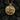 Gold variation of France pendant with intricate architectural details and pyramid bail design