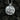 Front view of silver souvenir pendant showcasing Arc de Triomphe and Eiffel Tower relief