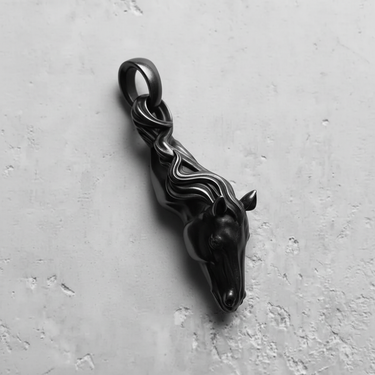 Dark oxidized sterling silver horse pendant with a matte finish, highlighting the intricate details of the mane and face.