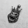Silver King Gorilla Pendant with a roaring expression and detailed crown, shown from the front on a textured surface.