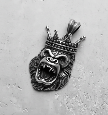 Oxidized 925 sterling silver king gorilla pendant showcasing intricate fur detail and sharp teeth, shown from a side angle.