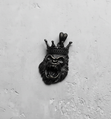 Dark oxidized finish on the Silver King Gorilla Pendant, emphasizing the deep shadows of the angry expression and crown.