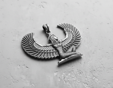 Angled view of silver winged Isis pendant showing detailed headdress and body contours with oxidized finish for depth
