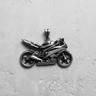 Oxidized 925 sterling silver motorcycle pendant showcasing the detailed engine and fairings in a top-down view.