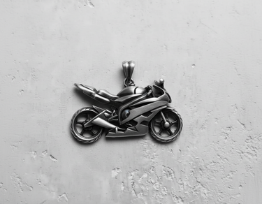 Oxidized 925 sterling silver motorcycle pendant showcasing the detailed engine and fairings in a top-down view.