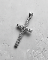 Polished 925 silver rustic cross pendant with a detailed wood grain texture and rope-wrapped center on a light background.