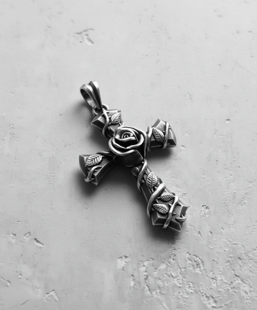 Angled view of the 925 sterling silver rose cross pendant, highlighting the three-dimensional vine and leaf craftsmanship.