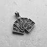 Silver Four Kings Pendant with four detailed playing cards fanned out, shown on a textured light gray surface.