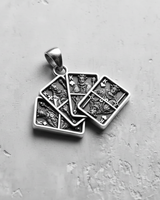 Angled view of the 925 sterling silver Four Kings Pendant, highlighting the oxidized finish and intricate royal details.