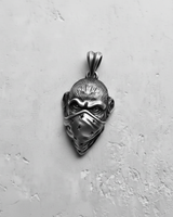 Front view of the handcrafted 925 sterling Silver Monkey Pendant, showcasing the furrowed brow and symmetrical star pattern on the mask.
