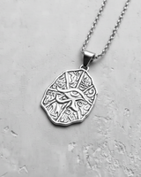 925 sterling silver Eye of Horus pendant with hieroglyphic details hanging on chain against white background