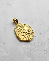Front view of 14K gold vermeil Egyptian Eye pendant with textured hieroglyphic background and Eye of Horus symbol