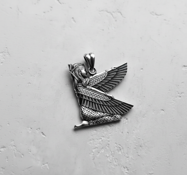 Close-up of the handcrafted Egyptian Isis pendant in sterling silver, focusing on the headdress and facial details of the goddess.
