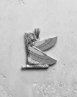 925 sterling silver Egyptian Isis pendant kneeling with spread wings on grey textured background