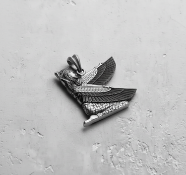 Angled view of oxidized sterling silver ancient Egyptian mythology pendant with bail