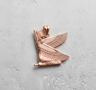 Rose gold plated silver Isis pendant showing the kneeling goddess with outstretched wings, detailed on a textured grey surface.