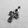 Silver Egyptian Ankh Pendant with an oxidized finish, showing the detailed Eye of Horus and radiating lines on a light gray surface.