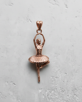 Rose gold plated sterling silver ballerina dancer pendant, detailed front view capturing the texture of the tutu and pointe shoes