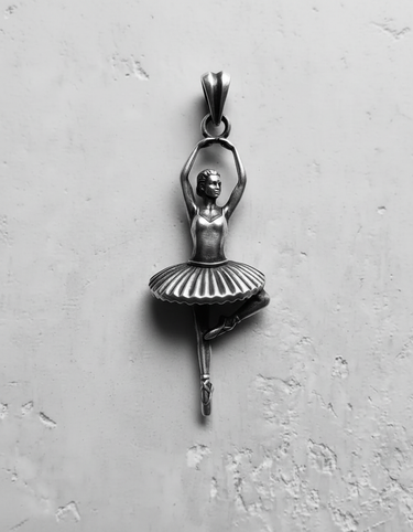 Polished 925 sterling silver ballerina pendant in a classic dance pose, photographed in black and white to highlight details.