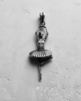 Oxidized sterling silver ballerina pendant in a classic black and white style, highlighting the intricate details of the tutu and form.