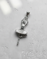 Polished 925 sterling silver ballerina pendant showing a graceful pose with raised arms and detailed tutu skirt.