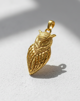 14K gold vermeil Silver Owl Pendant with detailed feathers and sculpted eyes, shown on a white textured surface.