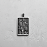 Top-down view of a 925 sterling silver Jack pendant, showcasing the detailed relief carving and oxidized finish.