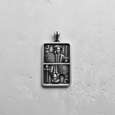 Top-down view of a 925 sterling silver Jack pendant, showcasing the detailed relief carving and oxidized finish.