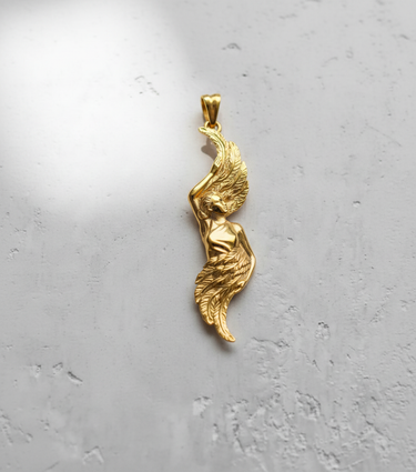 A gold-plated version of the angel wing pendant, highlighting the flowing, sculptural design and polished metallic finish.