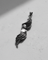 Angled view of the handcrafted Silver Angel Wing Pendant, emphasizing the oxidized finish and three-dimensional artistic form.